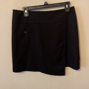 BEBE Black Mini Zip up in Back Skirt